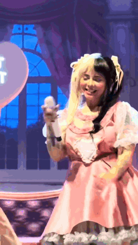 Woman In Pink Dress Holding Microphone GIF