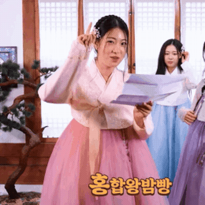 Woman In Pink Dress Holding Paper GIF