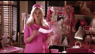 Woman In Pink Dress Holding Paper GIF