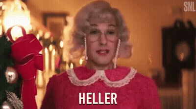 Woman In Pink Dress Holding Red Bow With Heller Behind GIF