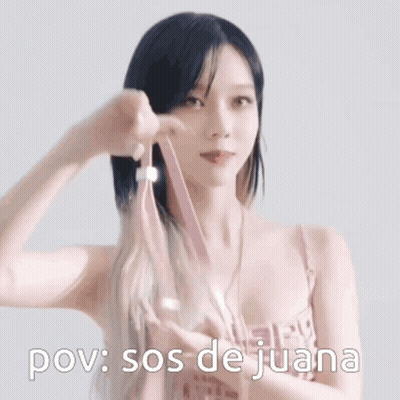 Woman In Pink Dress Holding Ribbon Says POV Sos De Juana GIF