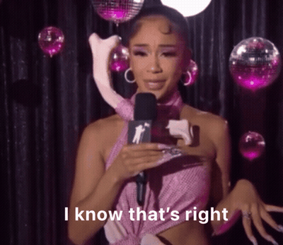 Woman In Pink Dress Holding Stuffed Animal GIF