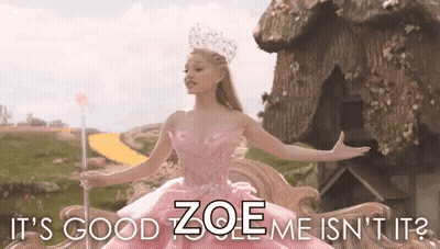 Woman In Pink Dress Holding Wand Says It's Good Zoe Me Isn't It GIF