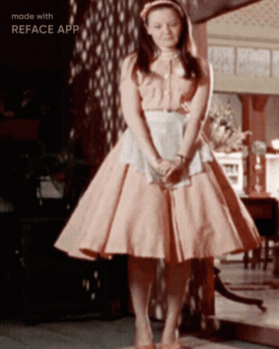 Woman In Pink Dress In Front Of Mirror Made With Reface App GIF
