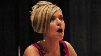 Woman In Pink Dress Making Funny Face GIF