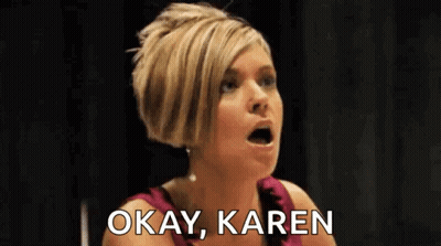 Woman In Pink Dress Making Funny Face Saying Okay Karen GIF