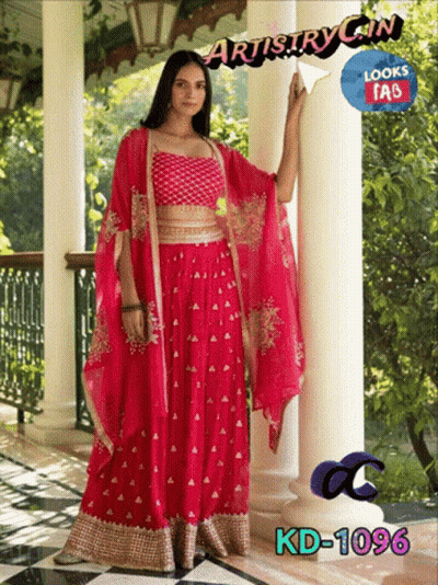 Woman In Pink Dress Next To Pillar Saying Artistry In Looks Fab GIF
