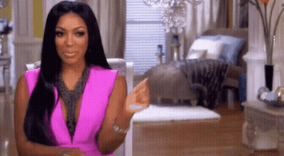 Woman In Pink Dress Pointing GIF