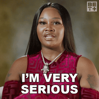 Woman In Pink Dress Saying I'm Very Serious GIF