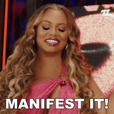 Woman In Pink Dress Says Manifest It GIF