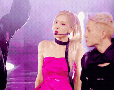 Woman In Pink Dress Singing Into Microphone GIF