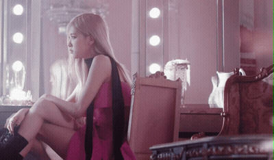 Woman In Pink Dress Sitting On Chair GIF