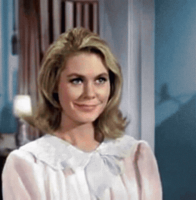 Woman In Pink Dress Smiling At Camera GIF