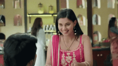 Woman In Pink Dress Smiling At Man GIF