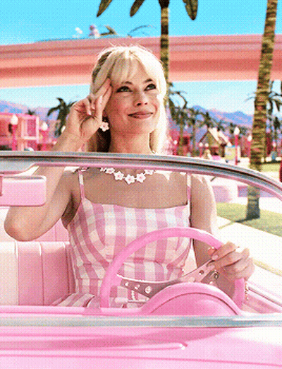 Woman In Pink Dress Smiling Driving Pink Car GIF