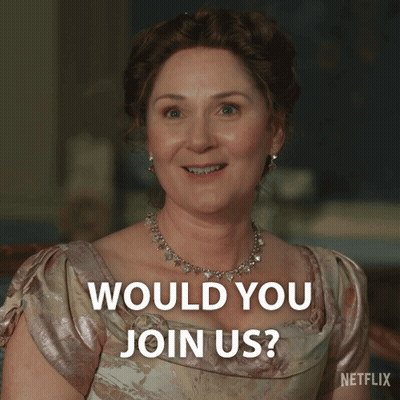 Woman In Pink Dress Smiling Says Would You Join Us GIF