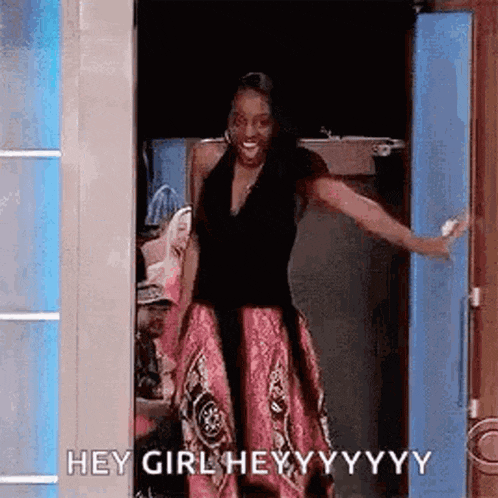 Woman In Pink Dress Standing In Doorway GIF