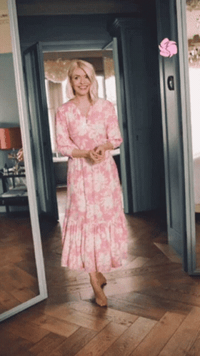 Woman In Pink Dress Standing In Hallway GIF