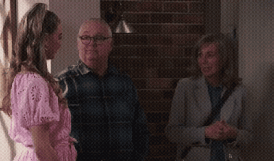 Woman In Pink Dress Talking To Man And Woman GIF