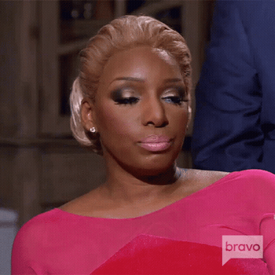 Woman In Pink Dress With Bravo Logo GIF
