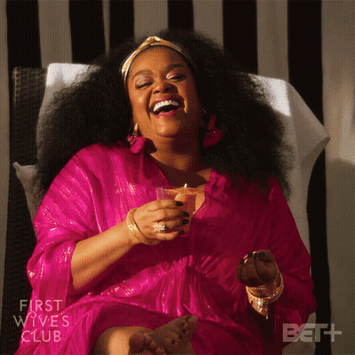 Woman In Pink Dress With Drink GIF