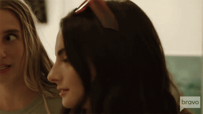 Woman In Pink Dress With Flower At Bravo House GIF