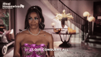Woman In Pink Dress With Love Conquers All GIF