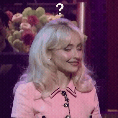 Woman In Pink Dress With Question Mark GIF