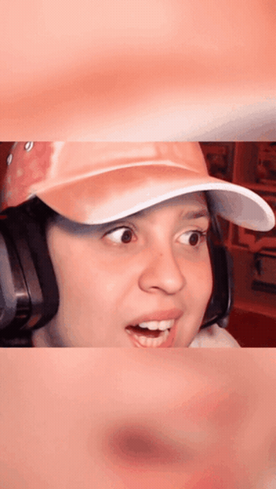 Woman In Pink Hat And Headphones Surprised GIF