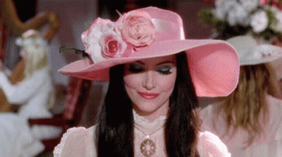 Woman In Pink Hat With Flower GIF