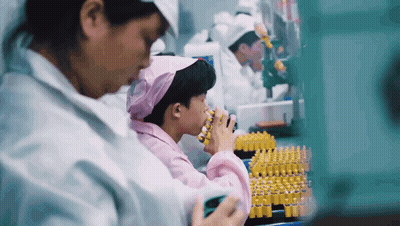Woman In Pink Head Scarf Working In Lab GIF