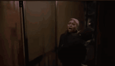 Woman In Pink Headband And Black Jacket GIF
