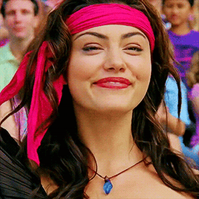 Woman In Pink Headband And Necklace Smiling GIF