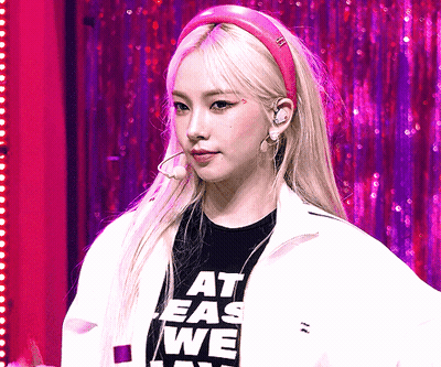 Woman In Pink Headband Saying At Ease We GIF