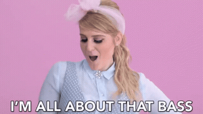 Woman In Pink Headband Saying I'm All About That Bass GIF