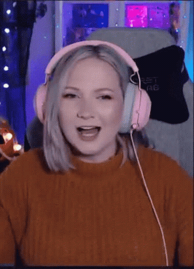 Woman In Pink Headphones Laughing GIF