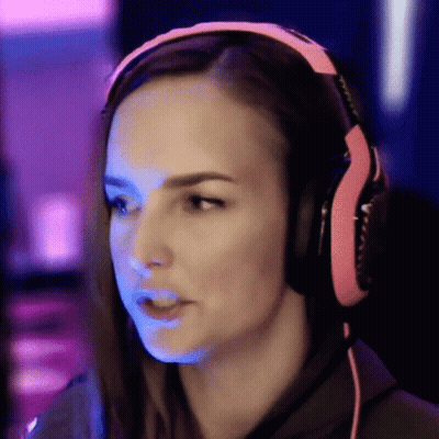 Woman In Pink Headphones Looking At Camera GIF