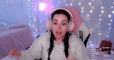 Woman In Pink Headphones Sitting In Pink Chair With Merc GIF