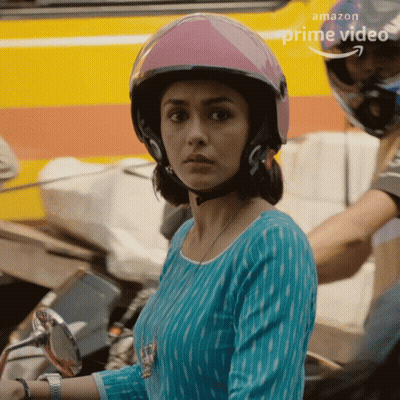 Woman in Pink Helmet in Front of Amazon Prime Video Ad