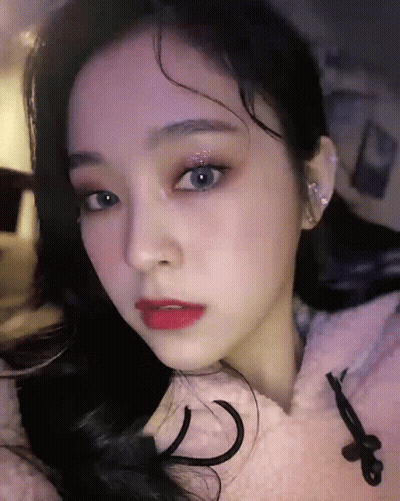 Woman In Pink Hoodie Close Up GIF