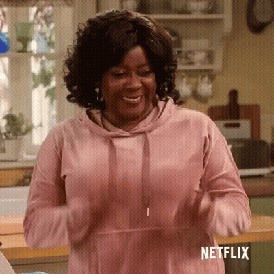 Woman In Pink Hoodie Standing In Kitchen Netflix GIF