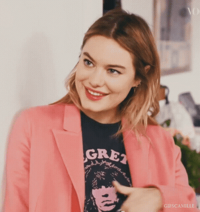 Woman In Pink Jacket And Black Shirt Saying Gre1 GIF