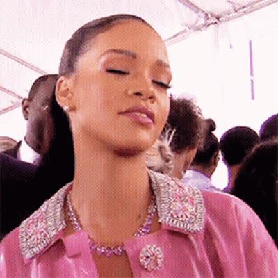 Woman In Pink Jacket And Necklace GIF