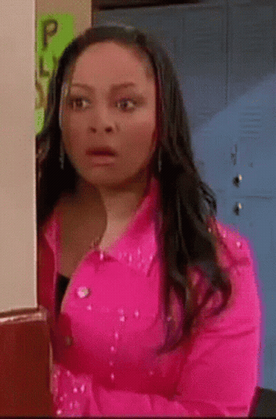 Woman In Pink Jacket At Lockers GIF