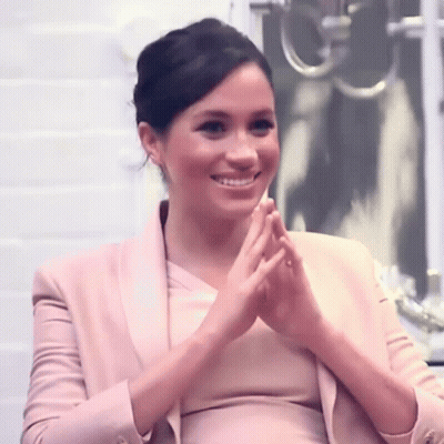 Woman In Pink Jacket Clapping And Smiling GIF