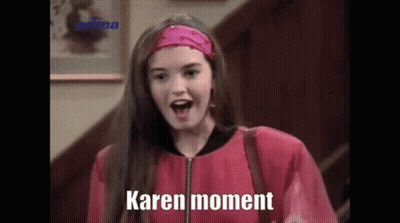Woman In Pink Jacket, Headband Saying Karen Moment GIF
