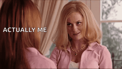 Woman In Pink Jacket Looking In Mirror Saying Actually Me GIF