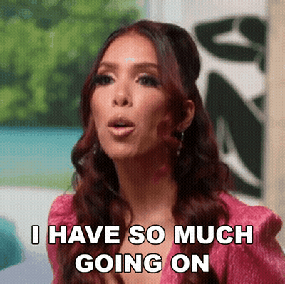 Woman In Pink Jacket Saying I Have So Much Going On GIF