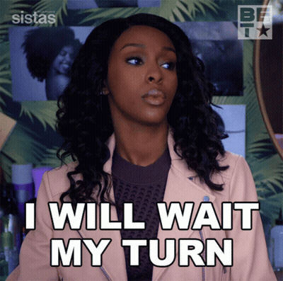 Woman In Pink Jacket Saying I Will Wait My Turn GIF