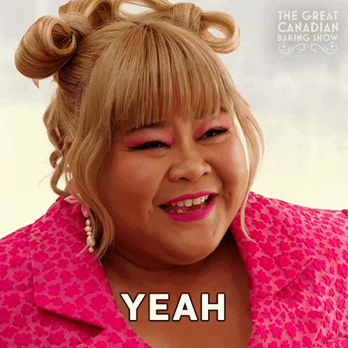 Woman In Pink Jacket Says Yeah In Front Of The Great Canadian Baking Show Poster GIF